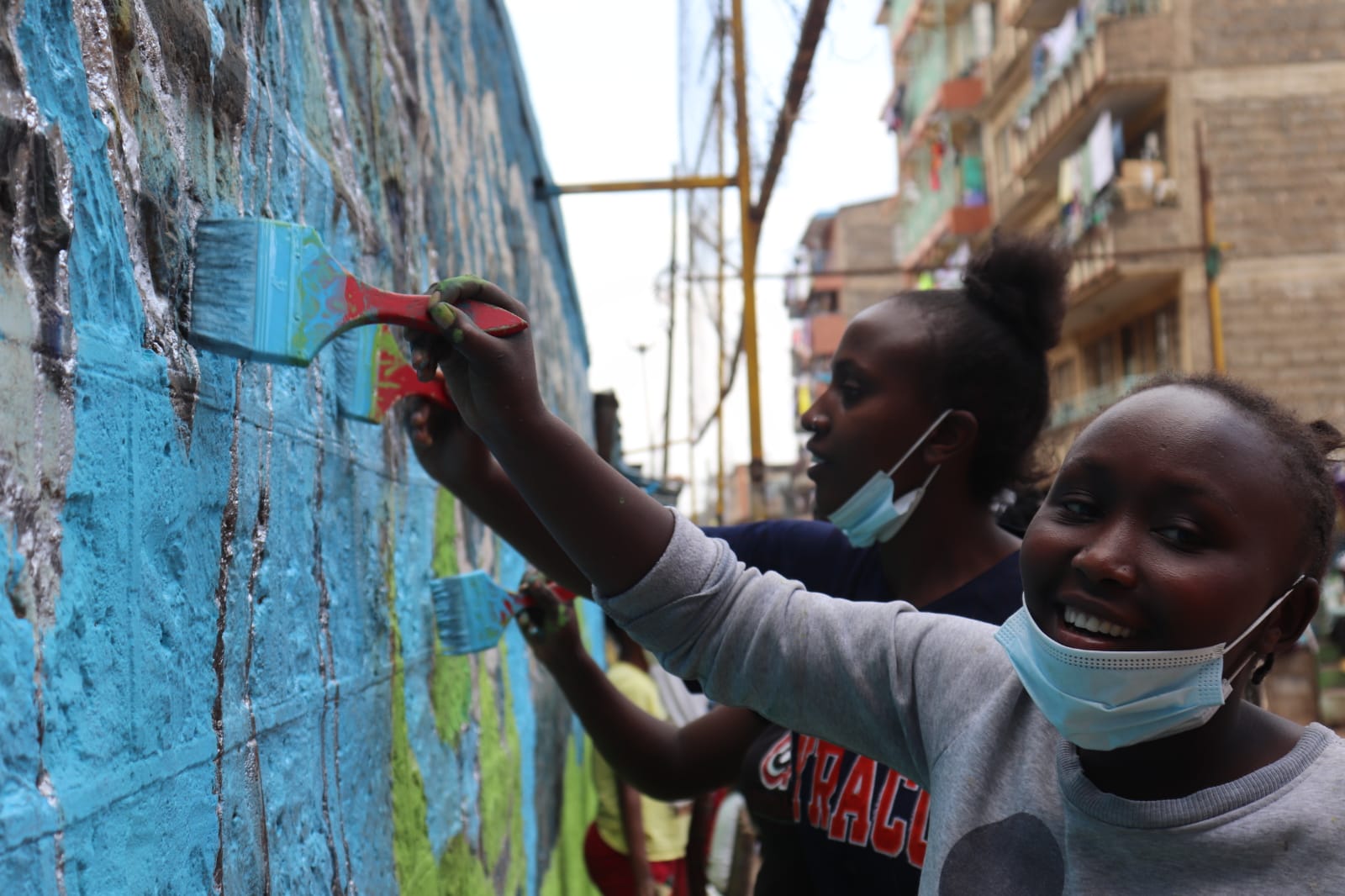 Young Mothers Soccer Team at work on the mural for the DigitalArt4Climate Competition, Nairobi, Kenya, September 2021
